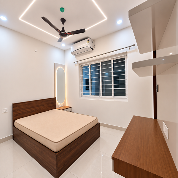 Modern bedroom, luxury bedroom, contemporary bedroom, spacious bedroom, apartment bedroom, stylish bedroom, wooden bed, double bed, queen size bed, wooden headboard, upholstered mattress, built-in wardrobe, modern wardrobe, white wardrobe, glossy cabinets, storage cabinets, wooden furniture, bedside table, dressing area, illuminated mirror, LED mirror, oval mirror, wall mirror, ceiling fan, air conditioner, large window, window grill, natural light, LED ceiling lights, recessed lighting, false ceiling, geometric ceiling design, glossy floor tiles, white flooring, clean interior, minimalist design, elegant home, premium apartment, luxury apartment, residential interior, modern home decor, contemporary furniture, wooden accents, neutral color scheme, spacious living space, organized bedroom, neat interior, modern architecture, urban apartment, residential property, luxury real estate, home interior.
